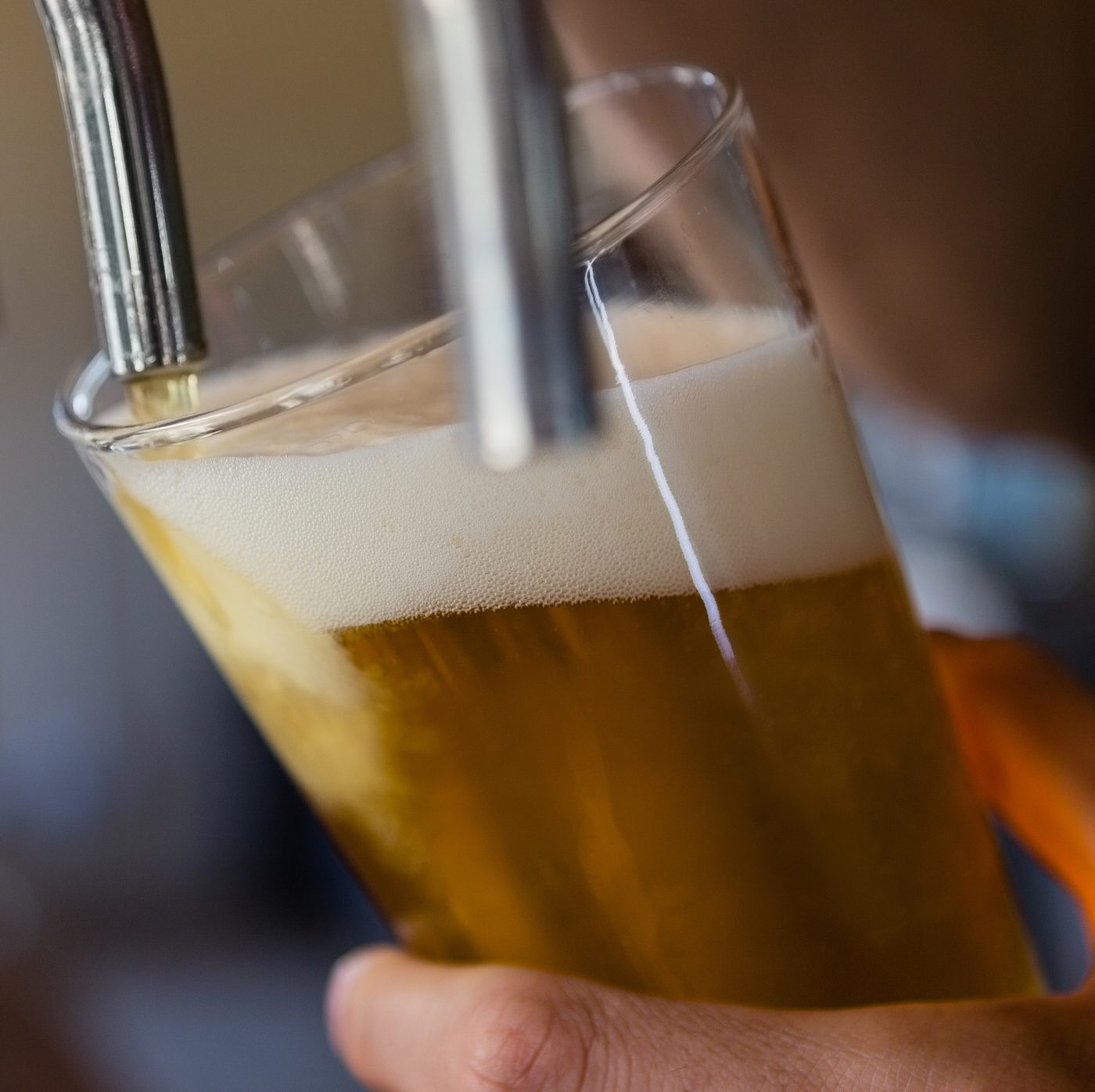 A cold beer pouring from the tap at Courtside Cantina
